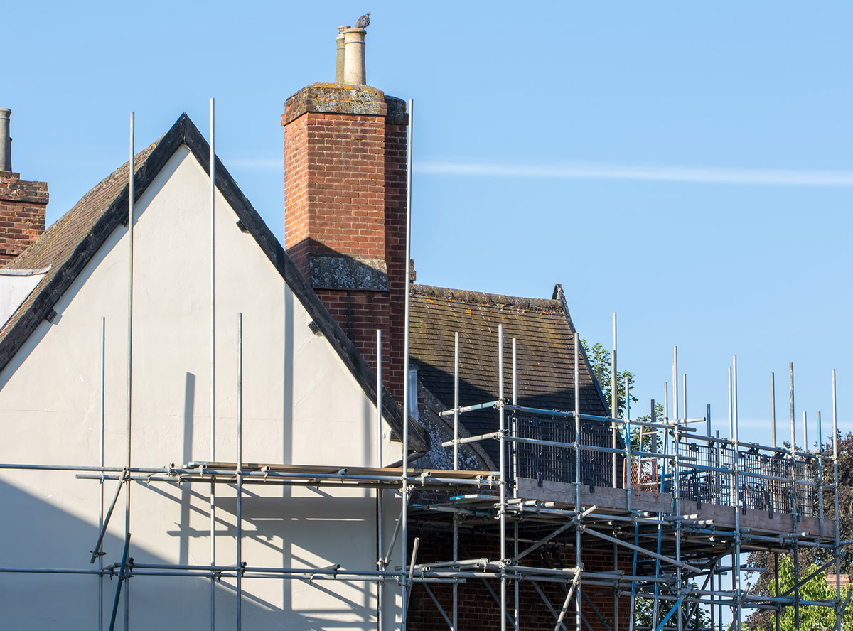 Scaffold platform erected for construction repair work on rural