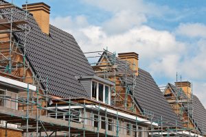 Construction of nearly finished family houses, built in a row